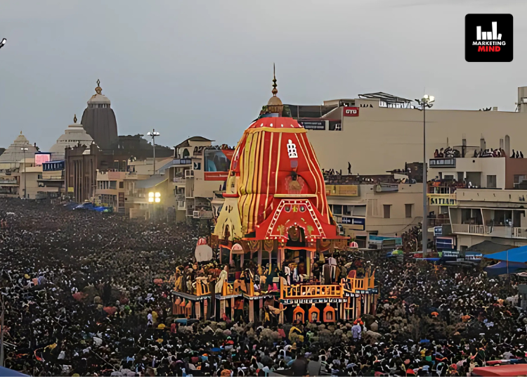 Colorful street festival with a large chariot at dusk.